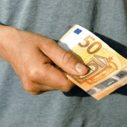 denomination-50-euros-mans-hand-600nw-1079493518
